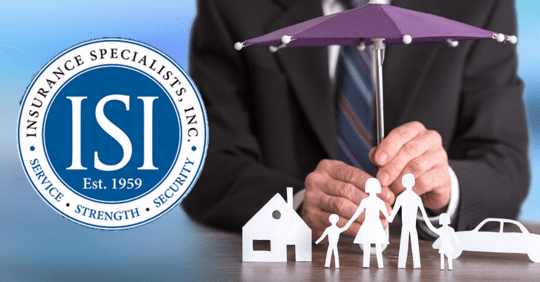 Agent holding umbrella over family